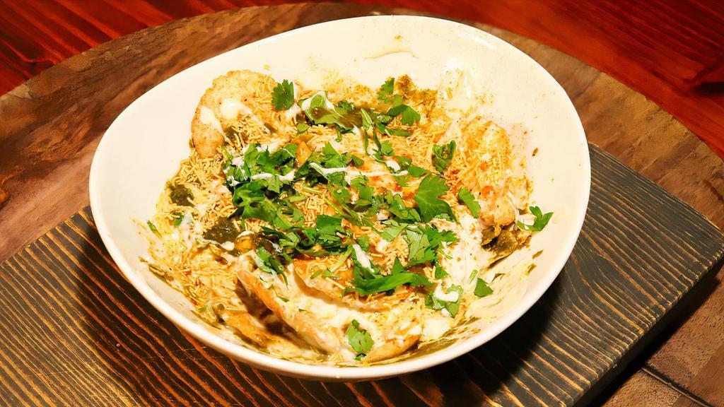 Dahi Papdi Chaat* · Crispy papri, along with chickpea, potatoes, yogurt, tamarind chutney & topped with sev