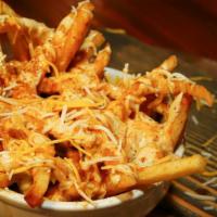 Crazy Curry Fries · Masala fries topped with cheese, tikka masala, housemate tamarind and Ayesha's secret sauce