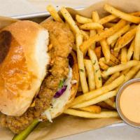 Fried Chicken Sandwich · Served with fries. Fried chicken thigh, coleslaw, sweet passion bun, mayonnaise, and spicy a...