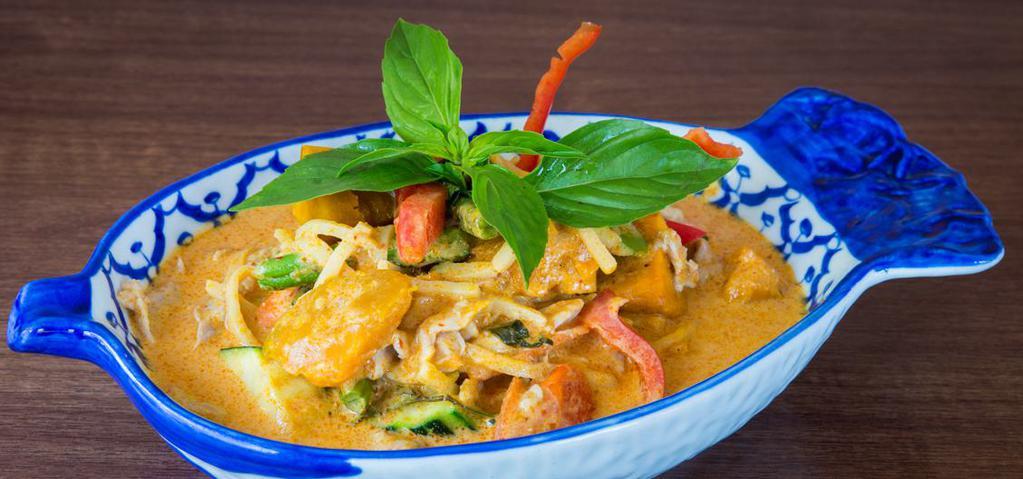 22. Pumpkin Curry · Choice of protein with red curry in coconut milk, pumpkin, zucchini, bamboo shoot, green beans, and sweet basil.