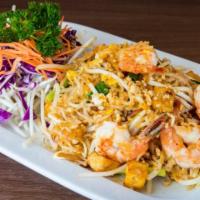35. Pad Thai · Thin rice noodles with chicken , onions, peanuts, tofu, egg green onions, and bean sprouts