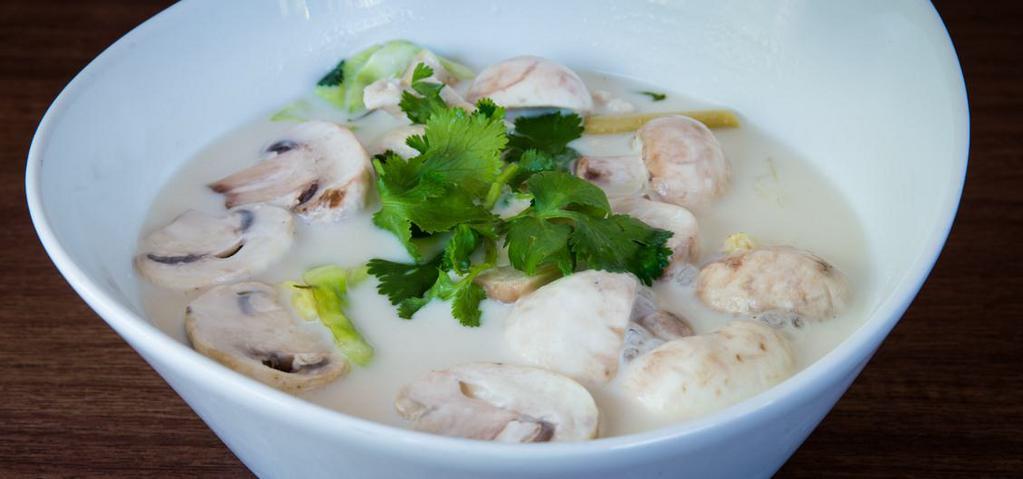 7. Chicken Tom Kha · Free-range hormone-free chicken in mild coconut soup with galangal, Cabbage, lemongrass, and carrot.