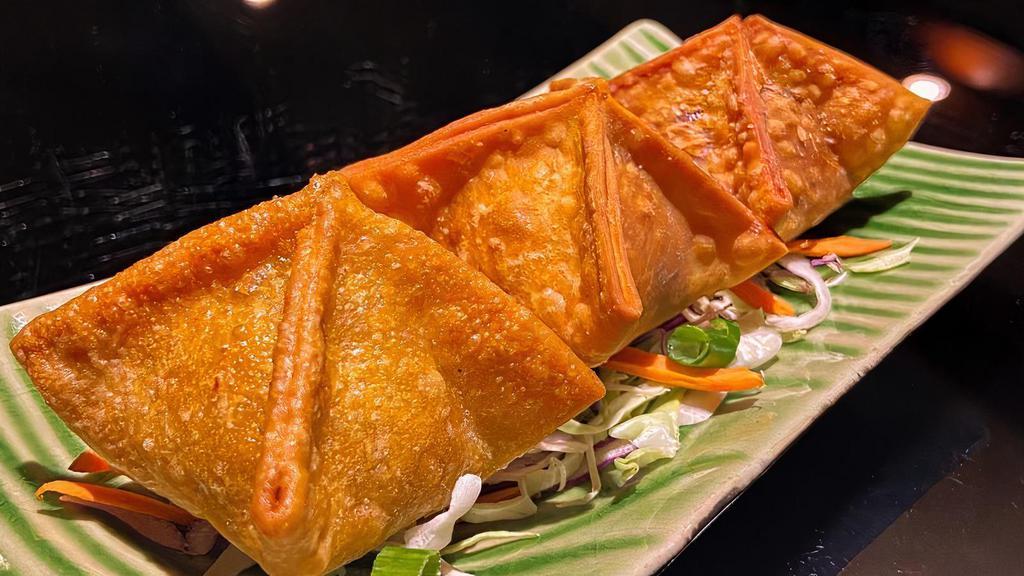 A8. Crab Rangoon · Crispy fried wontons filled with a mixture of cream cheese, crab meat, and carrots, served with housemade sweet and sour sauce.