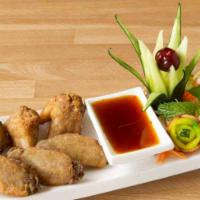 A14. Chicken Wings · Crispy deep fried chicken wings served with sweet and sour sauce, topping with crispy basil.
