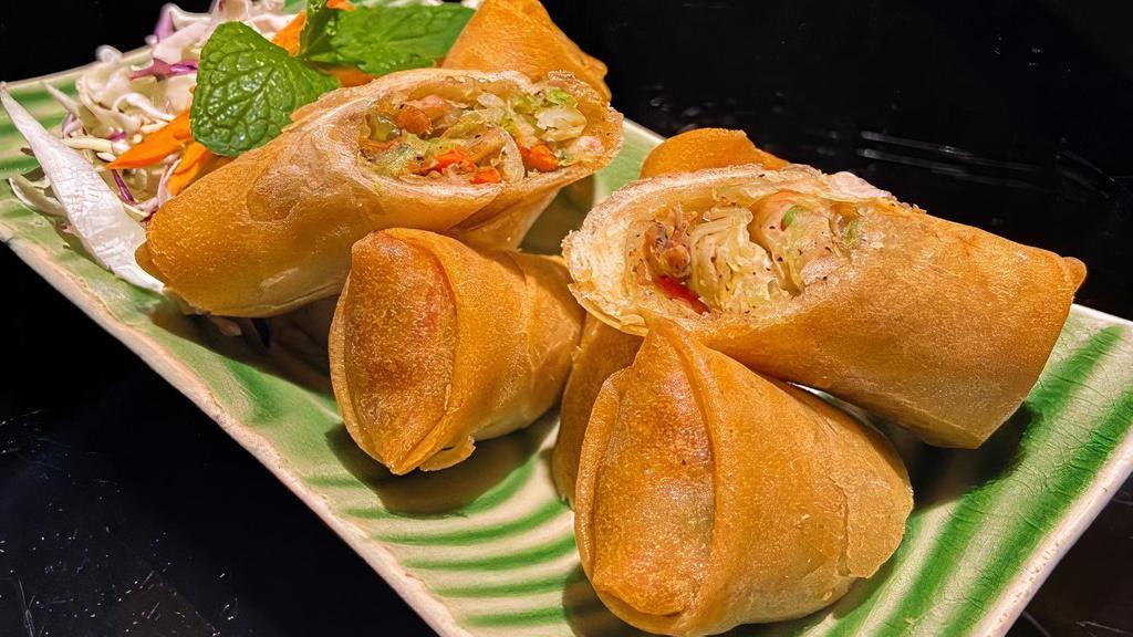 A3. Spring Rolls · Golden fried spring rolls filled with mixture of minced chicken, pork, vegetables, and bean thread noodles, served with sweet and sour sauce.