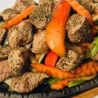 H4. Hot Pepper Sizzling Beef · Spicy. Sautéed beef stir fried with black pepper, red wine, bell peppers, carrots, green oni...