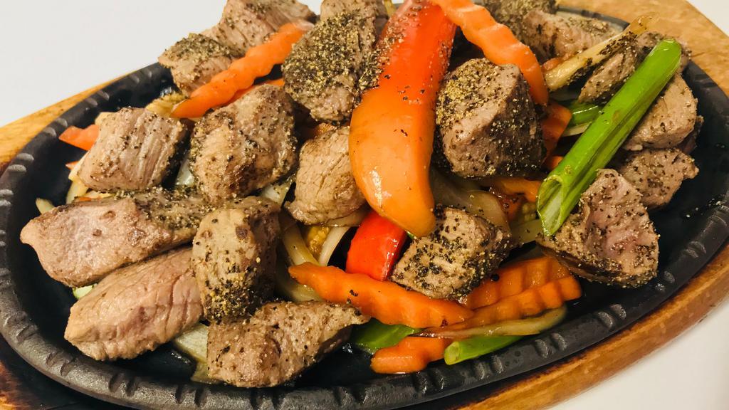 H4. Hot Pepper Sizzling Beef · Spicy. Sautéed beef stir fried with black pepper, red wine, bell peppers, carrots, green onions, onions, and baby corn.