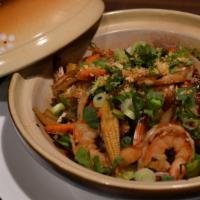 H8. Clay Pot Prawns · Prawn sautéed with crystal noodles and mixed vegetables topped with roasted garlic and onions.