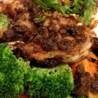W6. Pad Garlic & Pepper · Sautéed meat with garlic and black pepper served with steamed vegetables with a choice of ch...