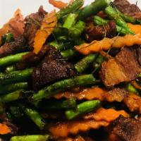 W13. Crispy Pork with Prik Khing Sauce · Crispy pork stir fried with green beans and carrots in prik-khing sauce.