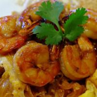 N1. Pad Thai · Thai stir fried rice noodles or spaghetti with tofu, sweet turnips, egg, roasted peanuts, be...