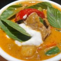 C2. Red Curry · Spicy. Thai style red curry cooked in coconut milk with an aromatic selection of Thai herbs,...