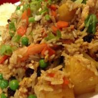 F2. Pineapple Fried Rice · Thai style curry fried rice with egg, onions, tomatoes, carrots, raisins, pineapple, and spr...
