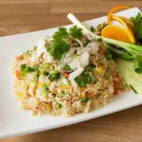 F6. Crab Fried Rice · Original Thai Style Crab Fried Rice with Spring Onion and Eggs.
