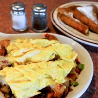 Country Skillet · Diced country fried steak, sautéed peppers and onions over seasoned homestyle potatoes, topp...