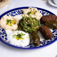 The Mezzet Club · Hummus, falafel, baba ganoush, tabouleh, and yoghurt served in a platter served with pita br...