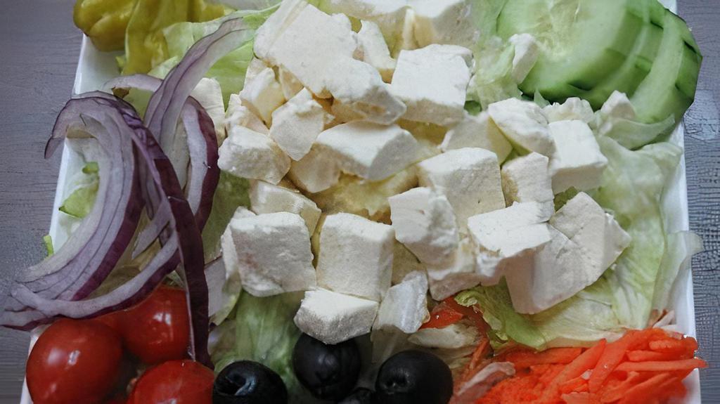 Via Mia Greek Salad · Lettuce, tomatoes, onion, olives, cucumber, artichoke hearts, carrots, pepperoncini and Feta cheese.