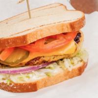 13. Cheeseburger · Lettuce, tomato, pickle, onion, jack cheese, mayo, and mustard.