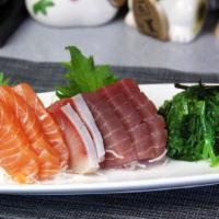 7. Sashimi Sampler · Eight pieces sashimi with seaweed salad.
