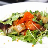 14. Poke Sashimi Salad · Assortment of sliced fish, spring mix with spicy poke dressing.
