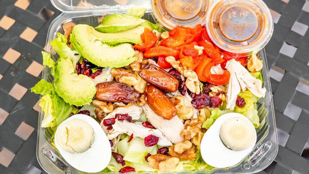 Marrakesh Express · Chicken, romaine, mediool dates, avocado, walnuts, chopped eggs, dried cranberries, red bell peppers with vinaigrette dressing.