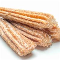 Churros · Sweet fried dough snacks dusted with sugar.