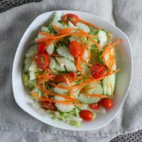 45. Green Salad · Lettuce tomatoes and cucumbers with house dressing.