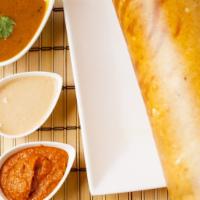 Paper Dosa · A super thin crispy crepe made of rice and lentil batter.