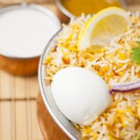 Vijayawada Chicken Biryani · Aromatic Basmati rice made with Indian herbs served over boneless chicken pieces mixed with ...