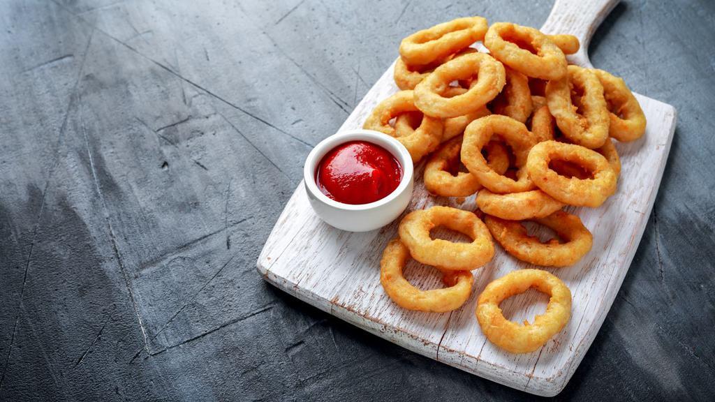 Basket of Onion Rings · Deep-fried golden onion rings.