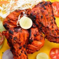 Tandoori Chicken - Full · Tender bone-in chicken, marinated with exotic tandoori spices. Most popular and spicy.