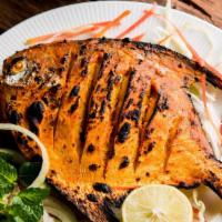 Tandoori Fish · Pomfret Fish whole marinated with exotic house special spices - cooked in Tandoor. Most popu...