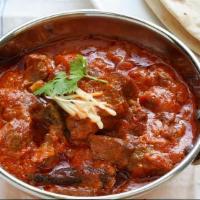 House Special Goat Curry · Baby goat cooked in traditional andhra style with homemade spices. Spicy.
