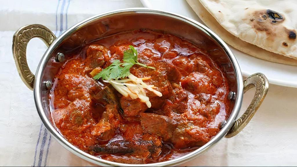 House Special Goat Curry · Baby goat cooked in traditional andhra style with homemade spices. Spicy.