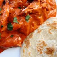 Butter Chicken · Clay oven baked chicken, cooked in rich tomato butter cream sauce. Most popular.