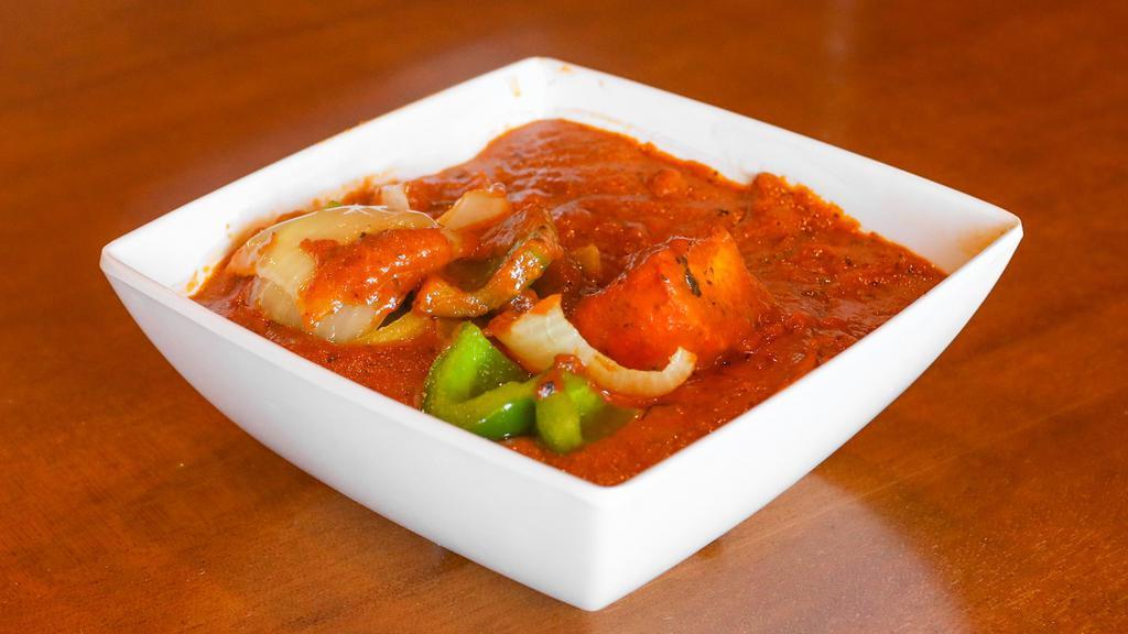 Chicken Tikka Masala · Chicken kebob in bay leaf flavored creamy tomato sauce with bell peppers and onion.