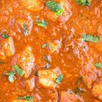 Chicken Vindaloo · Goan dish - seasoned chicken, cooked in rich spicy tangy gravy with potatoes, coconut and cu...