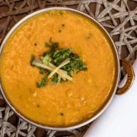 Tadka Dal · Boiled yellow lentil tempered with cumin, mustard, garlic and curry leaves. Veggie.