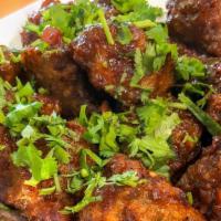 Vegetable Manchurian · Vegetarian deep fried balls tossed with soya sauce based gravy cooked to chef's perfection. ...