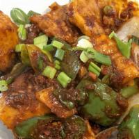 Chilly Fish · Battered fried tilapia fish stir-fried with sweet pepper, green chilies, onions and homemade...