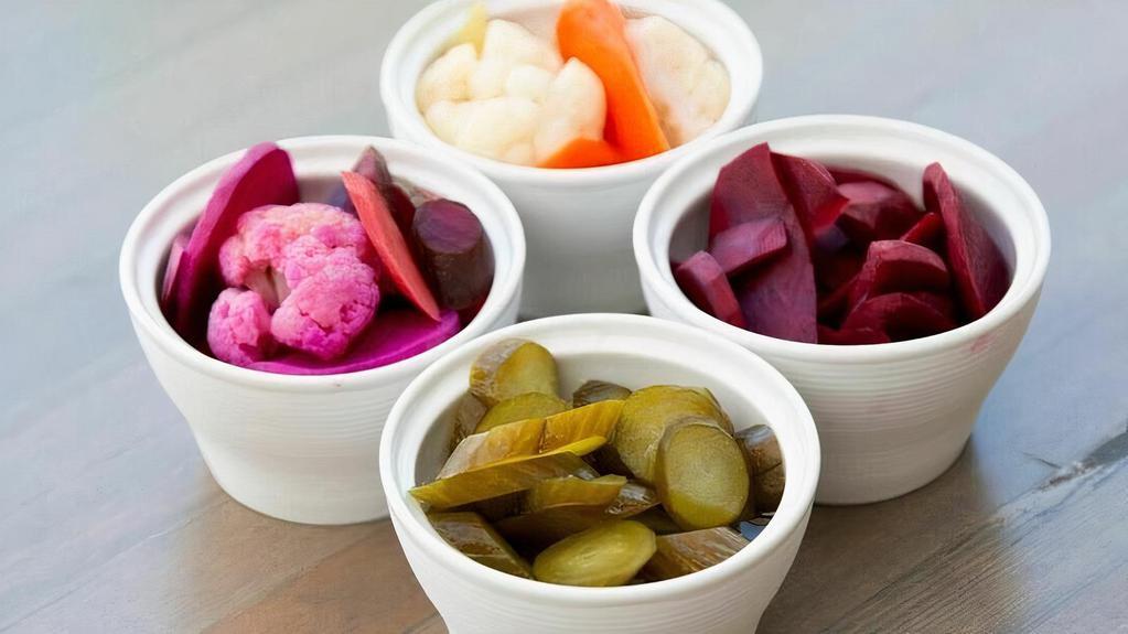 Pickled Vegetables · Naturally fermented in house with salt water garlic and dill.  Mix of Persian cucumber, cauliflower, carrots, celery, beets, turnips, red bell pepper. VE, GF