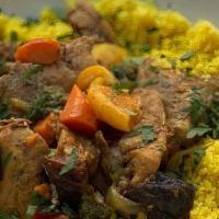 Chicken Tagine · Made with organic chicken. Served with couscous and chermoula (a slightly spicy sauce made w...