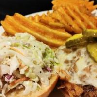 Pulled Pork Sandwich · apple cider slaw, pepper jack cheese, waffle fries, brioche bun, bread and butter pickles