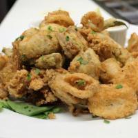 Fried Calamari · With fried green beans and artichokes served with chipotle aioli and lemon caper aioli.