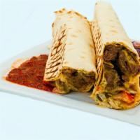 Lamb & Beef Shawerma Wrap · Hummus, tomato, Persian pickles,  red onions and tahini. wrapped in a Lavash Bread.  Served ...