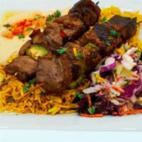 Sirloin Steak Kebab Plate · Two Skewers of Sirloin Steak Flame Grilled served with turmeric rice, hummus, cabbage salad,...