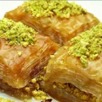 Home Made Baklava · Filo dough stuffed with cinnamon walnuts & pistachios  topped with rose water syrup