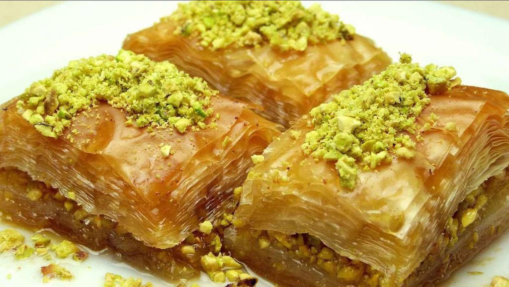 Home Made Baklava · Filo dough stuffed with cinnamon walnuts & pistachios  topped with rose water syrup