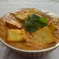 Paneer Tikka Masala · Cottage cheese simmered in creamy tomato sauce, accented with dry fenugreek.