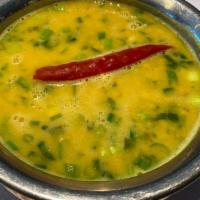 Dal Tadka · Vegan. Yellow split & red lentil cooked on onion tomato sauce with special Himalayan herbs a...